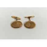 Pair of gentleman's 9ct gold cufflinks, of oval form with bark effect decoration, engraved