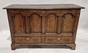 18th century oak mule chest, the opening lid raised over two short drawers each having two brass
