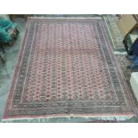Persian rug, red ground, multi gold in cream and green rectangular lozenge, with multi-border;