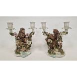 Pair German Plaue porcelain monkey candelabra, each two-branched and floral encrusted with monkeys