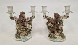 Pair German Plaue porcelain monkey candelabra, each two-branched and floral encrusted with monkeys