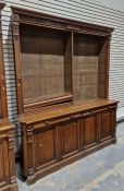Large late 19th/early 20th century oak library bookcase with eight adjustable shelves, raised over