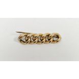 Yellow metal curb link style bar brooch, stamped 9ct, 4.8g