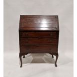 Early 20th century mahogany bureau, the drop front opening to reveal pigeonholes and a single