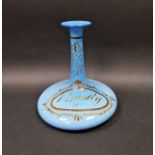 Mid 19th century opaque blue glass brandy decanter of compressed form with tall everted neck,