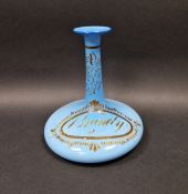 Mid 19th century opaque blue glass brandy decanter of compressed form with tall everted neck,