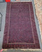 Eastern red ground carpet with geometric field, single geometric border, 305cm x 197cm (some wear)