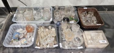 Collection of glass stoppers, drops, small mugs, bottles and other items, predominantly 19th century