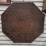 Indian carved wooden table-top, octagonal, allover floral and scroll decorated, 66cm diameter
