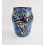 Large studio pottery vase of baluster form decorated with oxide stylised floral motifs on a blue