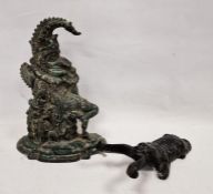 Mr Punch iron doorstop and a painted iron dog-pattern boot jack (2)