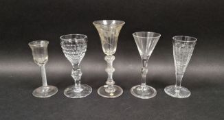 Group of five mid-18th and later drinking glasses, the first with flared bowl engraved with fruiting