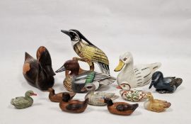 Assortment of carved wooden ducks and other birds, including decoys, some having painted decoration,