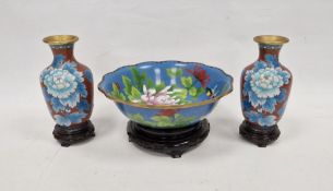 Modern Chinese cloisonne bowl, blue ground decorated with chrysanthemum and butterfly, within wave-