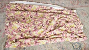 Two pairs of pinch pleat curtains printed with flowers on a dark pink ground, lined, each approx.