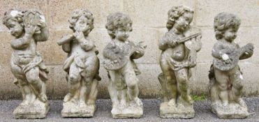 "Cherub Band" five composite stone figures of cherubs, each playing a different musical