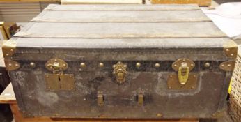 Early 20th century large wooden leather and brass-mounted travelling trunk, bound in wood and