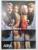 Signed ABBA publicity card bearing three signatures, Agnetha and two others and inscribed verso '