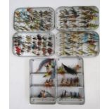 Three metal cases of salmon and fly fishing flies.