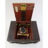 Bell & Howell 200 EE movie camera in brown leather carrying case, an Eastman Kodak folding bellows