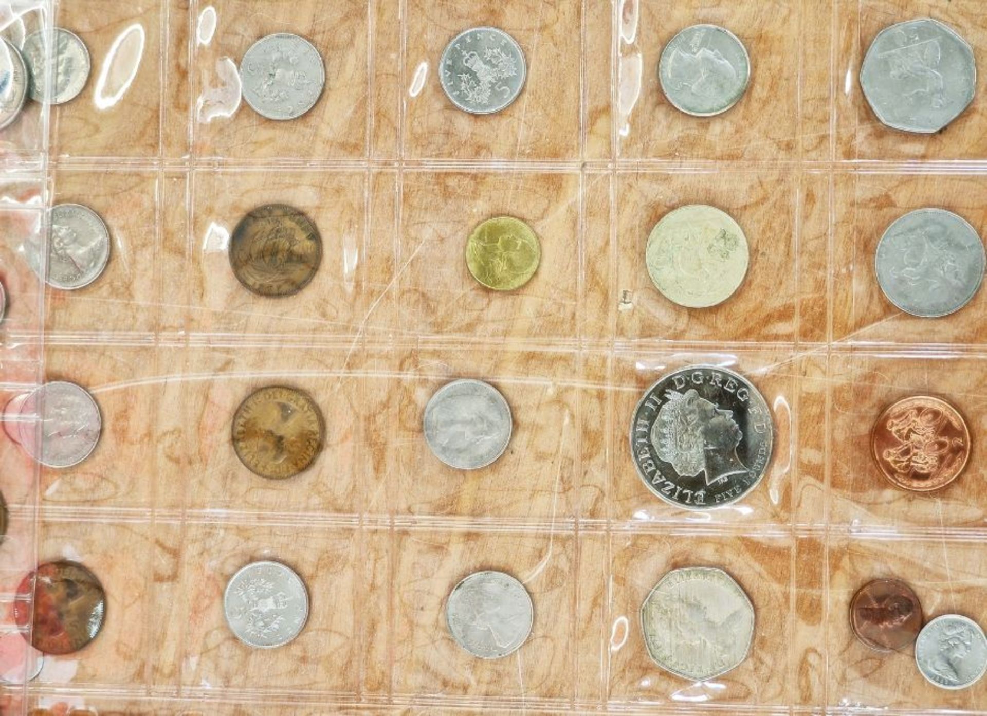 A large collection of English and World Coins contained within 17 sheets, some English silver, - Image 18 of 19