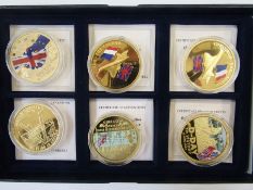 Group of commemorative medals, struck in copper, gold plated (13), millennium £5 (nickel), 1990