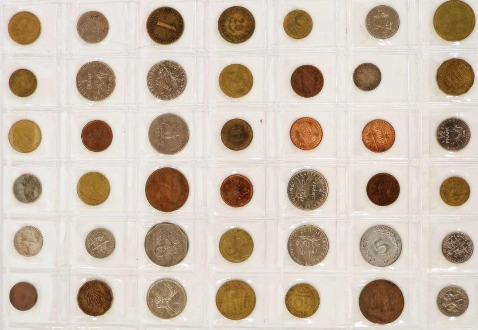 A large collection of English and World Coins contained within 17 sheets, some English silver, - Image 7 of 19