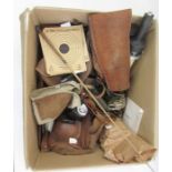 Three canvas and leather gun carrying slings, a small cartridge case, a sleeve with suede pad for