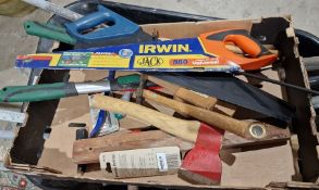 Assorted garden tools to include spades, forks, rakes, a pick axe, wheelbarrow, etc