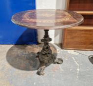 Late 19th/early 20th century circular pub table with stained oak top, raised on a cast iron base