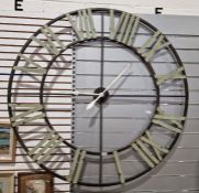 Vintage wall hanging clock with roman numerals to the dial