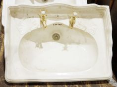 Vintage cast iron and enamel sink, two vintage ceramic sinks, two cisterns, two sink pedestals and
