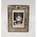 Edwardian art nouveau silver easel photograph frame, decorated on a textured ground with stylised
