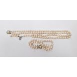 Two-strand cultured pearl necklace with silver clasp and matching two-strand cultured pearl bracelet