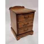 20th century pine bedside chest of drawers comprising three drawers, each with metal loop handles,