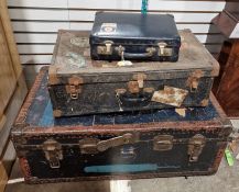 Large early 20th century wooden and metal-bound steamer trunk, 85cm wide, a smaller similar suitcase