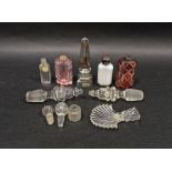 Group of Victorian coloured glass scent bottles, a Regency cut-glass fan-shaped caddy spoon and