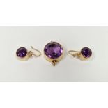 Gold amethyst and diamond pendant, the circular amethyst with small diamond drop below and