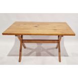 20th century pine dining table of rectangular form, raised on X-frame base, 74cm high x 138cm wide x