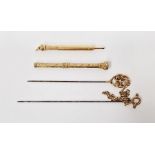 9ct gold scroll ended hat pin, another gold-coloured metal scroll ended hat pin linked by gold-