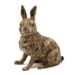 Cold-painted hare inkwell having hinged head, 14cm high