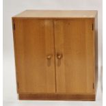 Modern two-door oak cupboard by Meredew, the doors opening to reveal two adjustable shelves with