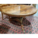 Regency mahogany tilt-top breakfast table of circular form, raised on a tripod base with hipped