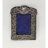 Late Victorian silver mounted photograph frame, the silver having scrolling pierced and embossed