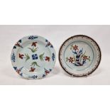 Two late 18th century polychrome English delftware plates, circa 1770, the first painted with a