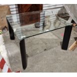 Modern glass-topped coffee table of square form raised upon black and chrome legs, 41cm high x