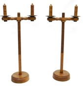 Pair tall oak screw-top twin branch holders adapted as candle stands, 57cm high with fittings (2)