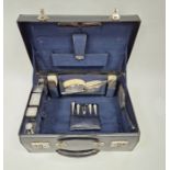 George VI silver mounted vanity set by Walker and Hall, housed in original leather carry case, to