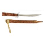 Eastern short sword with curved blade and having carved wood scabbard and handle, 66cm long overall