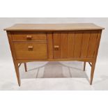 Mid century polished wood sideboard with bevelled top above cupboard and two drawers, raised on